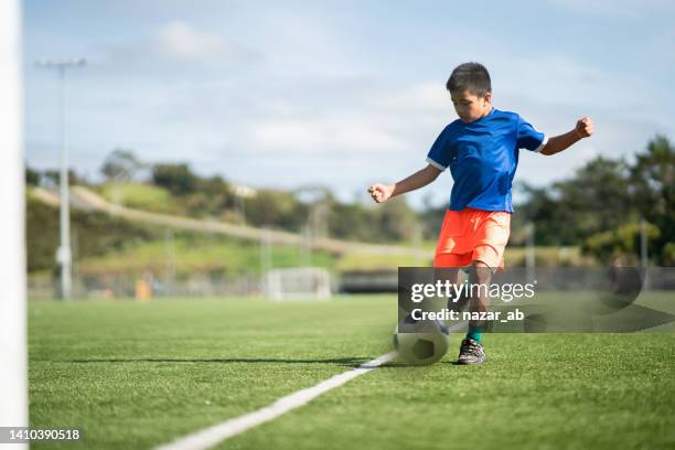 playing soccer. - kicking soccer stock pictures, royalty-free photos & images