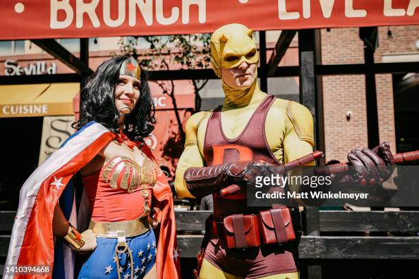 Cosplayers dressed as Wonder Woman and Daredevil attend 2022 Comic-Con International: San Diego on July 22, 2022 in San Diego, California.