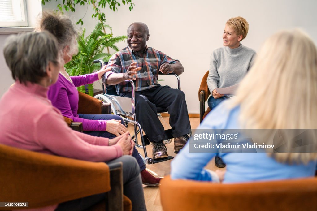 Group therapy in session sitting in a circle
