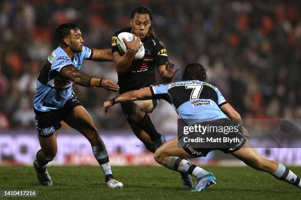 Jarome Luai of the Panthers is tackled during the round 19 NRL match between the Penrith Panthers and the Cronulla Sharks at BlueBet Stadium on July...