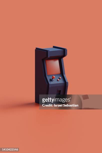 digitally generated image of a blue arcade machine on an orange background. - arcade machine stockfoto's en -beelden