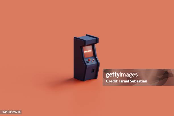 3d illustration of a blue arcade machine on an orange background. on the screen appears the text game over. - digital era stock-fotos und bilder
