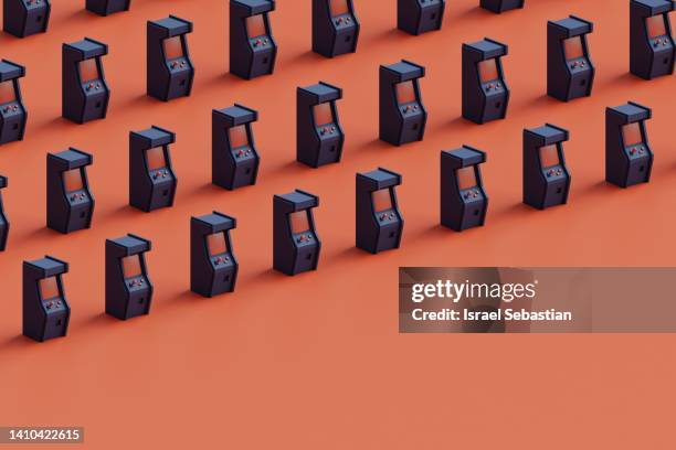 3d illustration of a blue arcade cabinet pattern on orange background. - arcade cabinet stock pictures, royalty-free photos & images