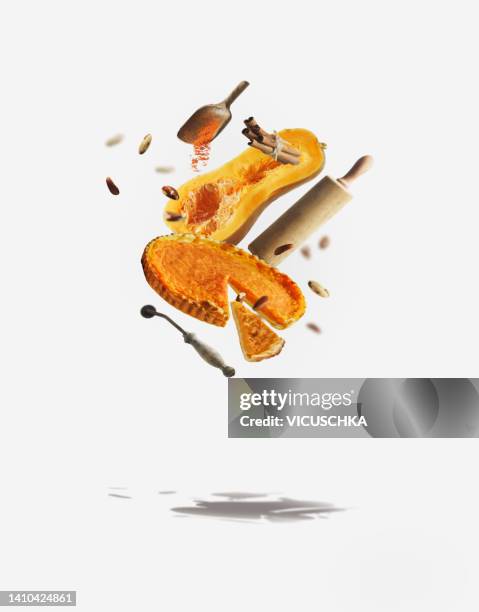 levitation of flying pumpkin pie, ingredients and baking tools at white background with shadow - utensílio de cozinha equipamento doméstico - fotografias e filmes do acervo