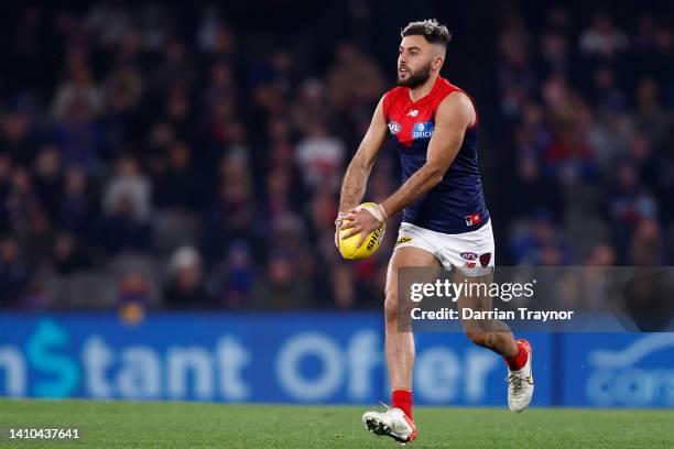 Christian Salem of the Demons runs with the ball during the round 19 AFL match between the Western Bulldogs and the Melbourne Demons at Marvel...