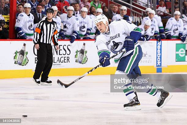 Sami Salo of the Vancouver Canucks shoots the puck during the NHL game against the Phoenix Coyotes at Jobing.com Arena on February 28, 2012 in...