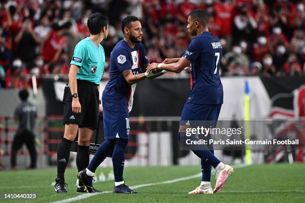 Kylian Mbappe of Paris Saint-Germain is replaced by Neymar Jr during the preseason friendly between Paris Saint-Germain and Urawa Red Diamonds at...