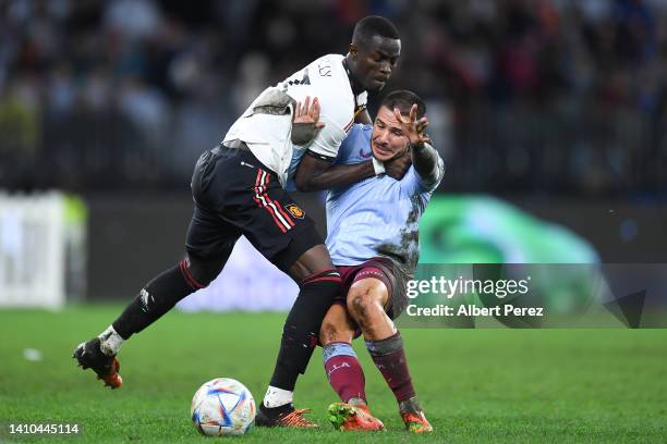 Eric Bailly of Manchester United and Emiliano Buendia of Aston Villa compete for the ball during the Pre-Season Friendly match between Manchester...