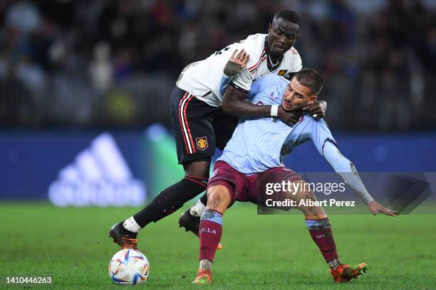 Eric Bailly of Manchester United and Emiliano Buendia of Aston Villa compete for the ball during the Pre-Season Friendly match between Manchester...
