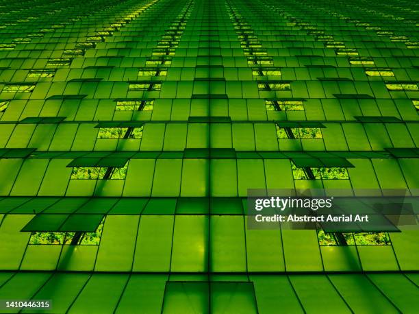 green lighting illuminating a greenhouse at night seen from above, netherlands - nursery night stock pictures, royalty-free photos & images