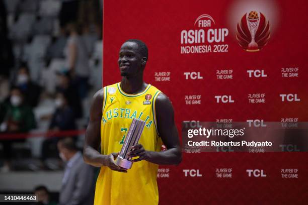 Thon Maker of Australia poses with his MVP trophy during the FIBA Asia Cup semi-final between Australia and New Zealand at Istora Gelora Bung Karno...