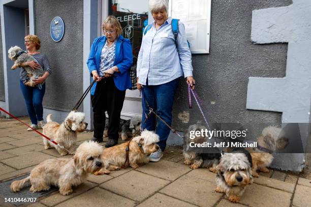 Dandie Dinmont owners attend the unveiling of a plaque at The Fleece Hotel where a meeting held in 1875 led to the formation of the Dandie Dinmont...