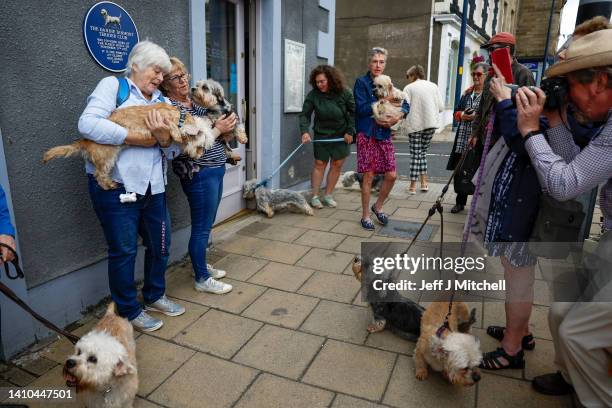 Dandie Dinmont owners attend the unveiling of a plaque at The Fleece Hotel where a meeting held in 1875 led to the formation of the Dandie Dinmont...