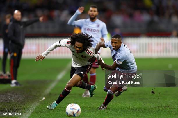 Tahith Chong of Manchester United and Ashley Young of Aston Villa contest for the ball during the Pre-Season Friendly match between Manchester United...