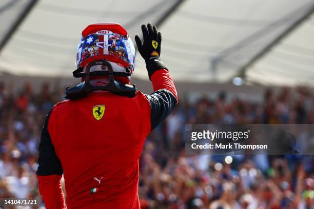 Pole position qualifier Charles Leclerc of Monaco and Ferrari waves to the crowd in parc ferme during qualifying ahead of the F1 Grand Prix of France...
