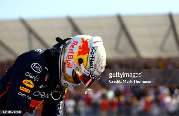 Second placed qualifier Max Verstappen of the Netherlands and Oracle Red Bull Racing climbs from his car in parc ferme during qualifying ahead of the...