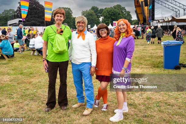 Festival goers pose as characters from the TV programme 'Scooby Doo' during the 2022 Rewind Festival: Scotland at Scone Palace on July 23, 2022 in...