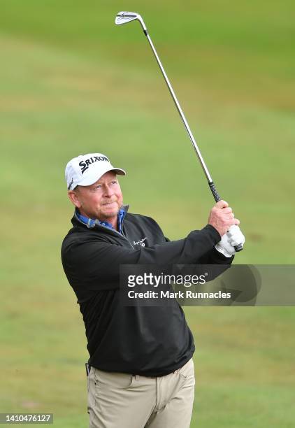 Kent Jones of United States plays his second shot at the 1st hole during Day Three of The Senior Open Presented by Rolex at The King's Course at...