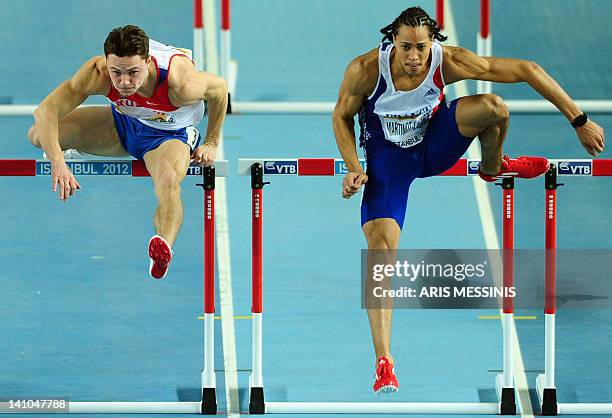 Russia's Konstantin Shabanov and France's Pascal Martinot-Lagarde compete in the men's 60m hurdles qualifications at the 2012 IAAF World Indoor...