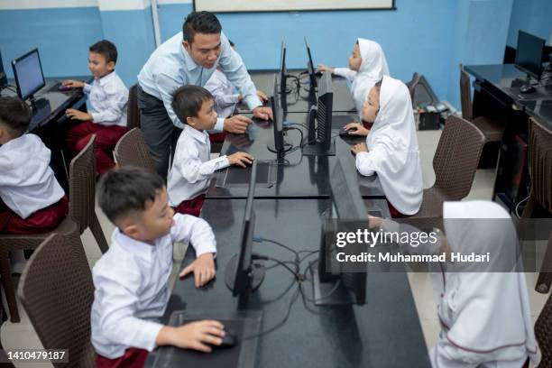 students and teachers study in computer lab - archival classroom stock pictures, royalty-free photos & images