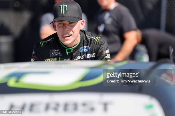 Riley Herbst, driver of the Monster Energy Ford, waits on the grid during qualifying for the NASCAR Xfinity Series Explore the Pocono Mountains 225at...