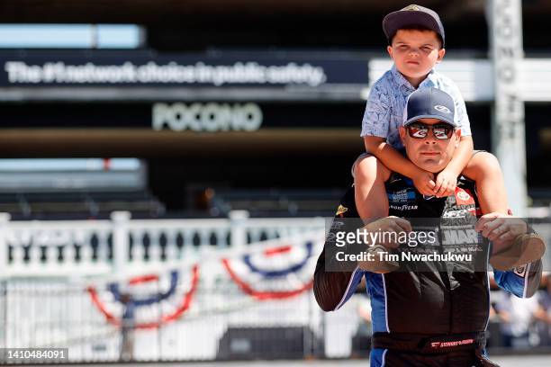 Stewart Friesen, driver of the Halmar International Toyota, and son Parker waits on the grid prior to the NASCAR Camping World Truck Series CRC...