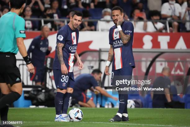 Neymar Jr and Lionel Massi of Paris Saint-Germain looks on during the preseason friendly between Paris Saint-Germain and Urawa Red Diamonds at...