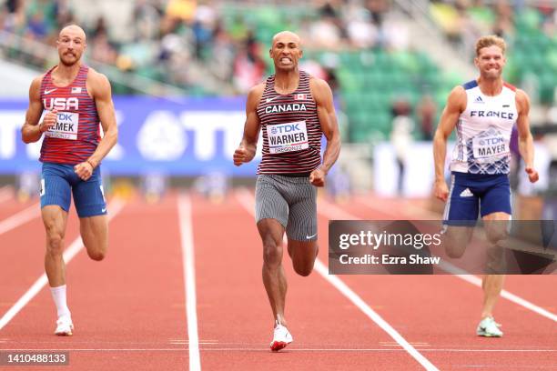 Zachery Ziemek of Team United States, Damian Warner of Team Canada and Kevin Mayer of Team France compete in the Men's Decathlon 100m heats on day...