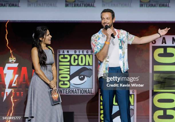 Tiffany Smith and Zachary Levi speak onstage at the Warner Bros. Theatrical session with "Black Adam" and "Shazam: Fury of the Gods" panel during...