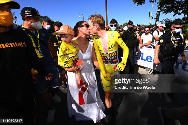Jonas Vingegaard Rasmussen of Denmark and Team Jumbo - Visma - Yellow Leader Jersey celebrates with his daughter Frida and wife Trine Hansen as...