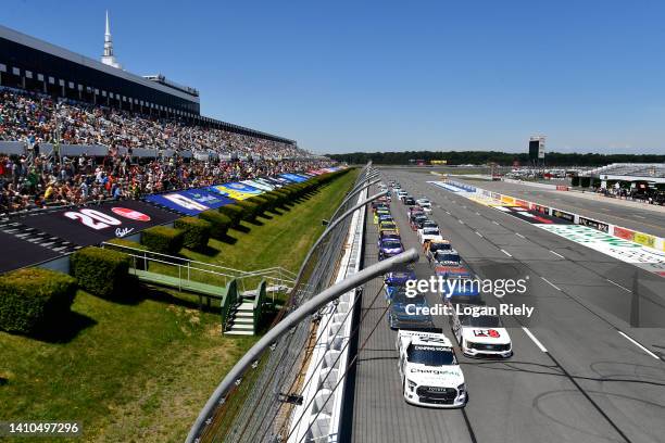 Chandler Smith, driver of the Charge Me Toyota, leads the field during the NASCAR Camping World Truck Series CRC Brakleen 150 at Pocono Raceway on...