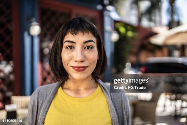 portrait of a young woman outdoors - woman short fringe stock pictures, royalty-free photos & images