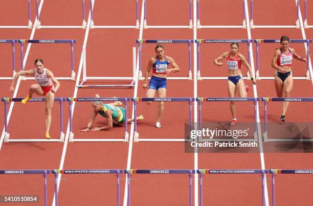 Liz Clay of Team Australia falls as they compete in the Women's 100m Hurdles heats on day nine of the World Athletics Championships Oregon22 at...