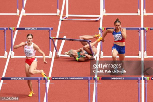 Liz Clay of Team Australia falls as they compete in the Women's 100m Hurdles heats on day nine of the World Athletics Championships Oregon22 at...