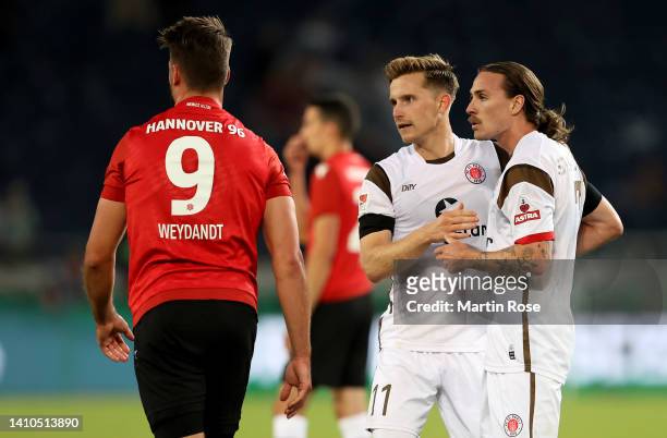 Jackson Irvine of FC St. Pauli celebrate with team mate Johannes Eggestein after the Second Bundesliga match between Hannover 96 and FC St. Pauli at...