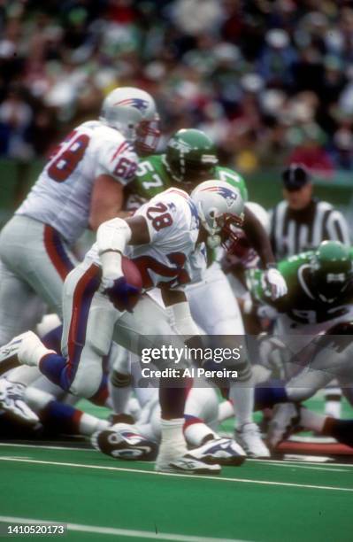 Running Back Curtis Martin of the New England Patriots rushes the ball against the New York Jets during the New England Patriots vs New York Jets...