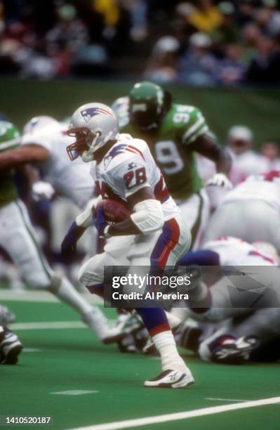 Running Back Curtis Martin of the New England Patriots rushes the ball against the New York Jets during the New England Patriots vs New York Jets...