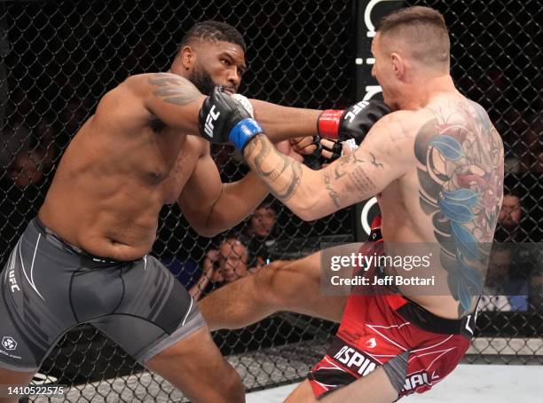 Curtis Blaydes and Tom Aspinall of England trade strikes in a heavyweight fight during the UFC Fight Night event at O2 Arena on July 23, 2022 in...