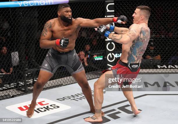 Curtis Blaydes punches Tom Aspinall of England in a heavyweight fight during the UFC Fight Night event at O2 Arena on July 23, 2022 in London,...