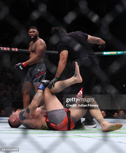 Tom Aspinall of England gets injured in the first round of his Heavyweight bout against Curtis Blaydes of USA during UFC Fight Night at O2 Arena on...
