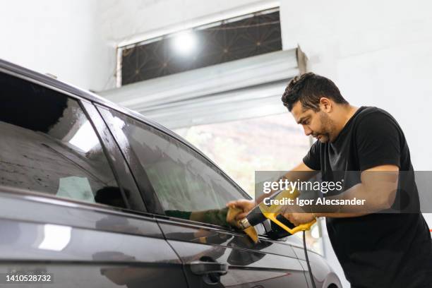 car window film installation service - polishing window stock pictures, royalty-free photos & images