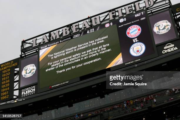 Message is displayed on the Big Screen as the start of play is delayed during the pre-season friendly match between Bayern Munich and Manchester City...