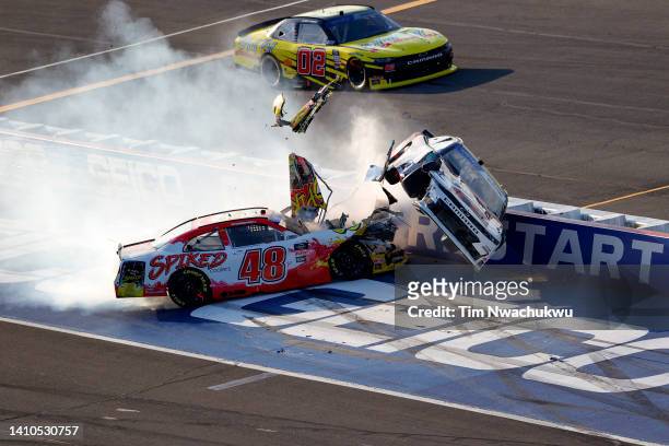 Jeb Burton, driver of the Puryear Tank Lines Chevrolet, flips after an on-track incident with Ricky Stenhouse Jr., driver of the Big Machine Spiked...