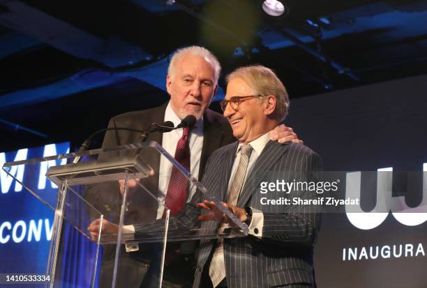 Honoree Barry Scheck accepts his award from Gregg Popovich on stage as United Justice Coalition hosts Inaugural Social Justice Summit with acclaimed...