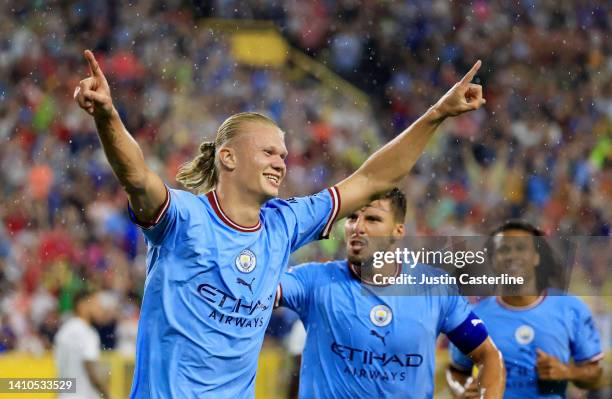 Erling Haaland of Manchester City celebrates after scoring their team's first goal during the pre-season friendly match between Bayern Munich and...