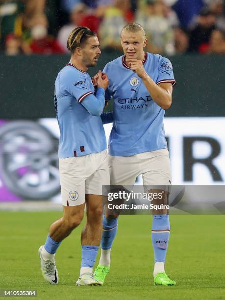 Erling Haaland of Manchester City celebrates with Jack Grealish after scoring their team's first goal during the pre-season friendly match between...