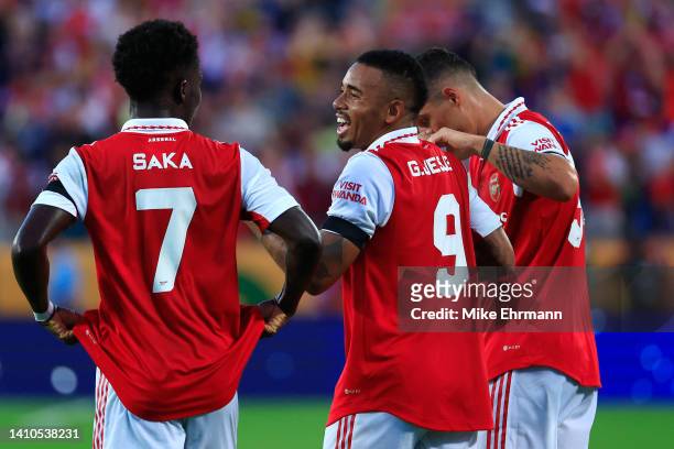 Gabriel Jesus of Arsenal celebrates with teammates Bukayo Saka and Granit Xhaka after scoring their side's first goal during the Florida Cup match...