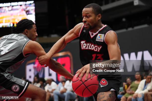 Isaiah Briscoe of the Trilogy moves around Elijah Stewart of the Enemies during BIG3 Week Six at Comerica Center on July 23, 2022 in Frisco, Texas.