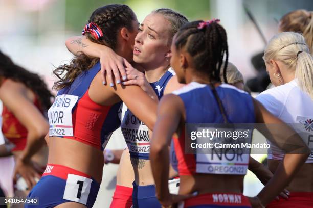 Amalie Iuel and Linn Oppegaard of Team Norway embrace after competing in the Women's 4x400m Relay heats on day nine of the World Athletics...