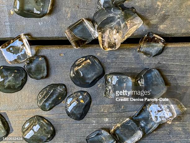 ice cubes melting on deck - panyik-dale stock pictures, royalty-free photos & images